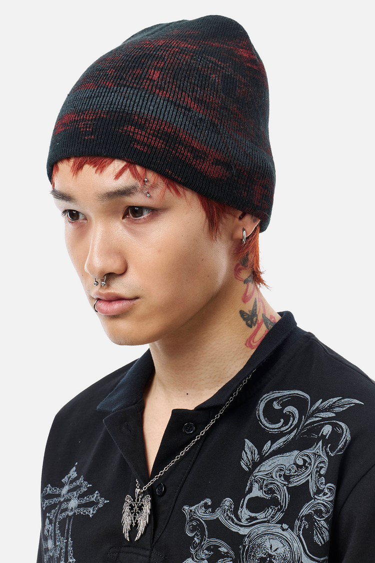 Model wearing the Chaos Beanie pulled low, three-quarter front view