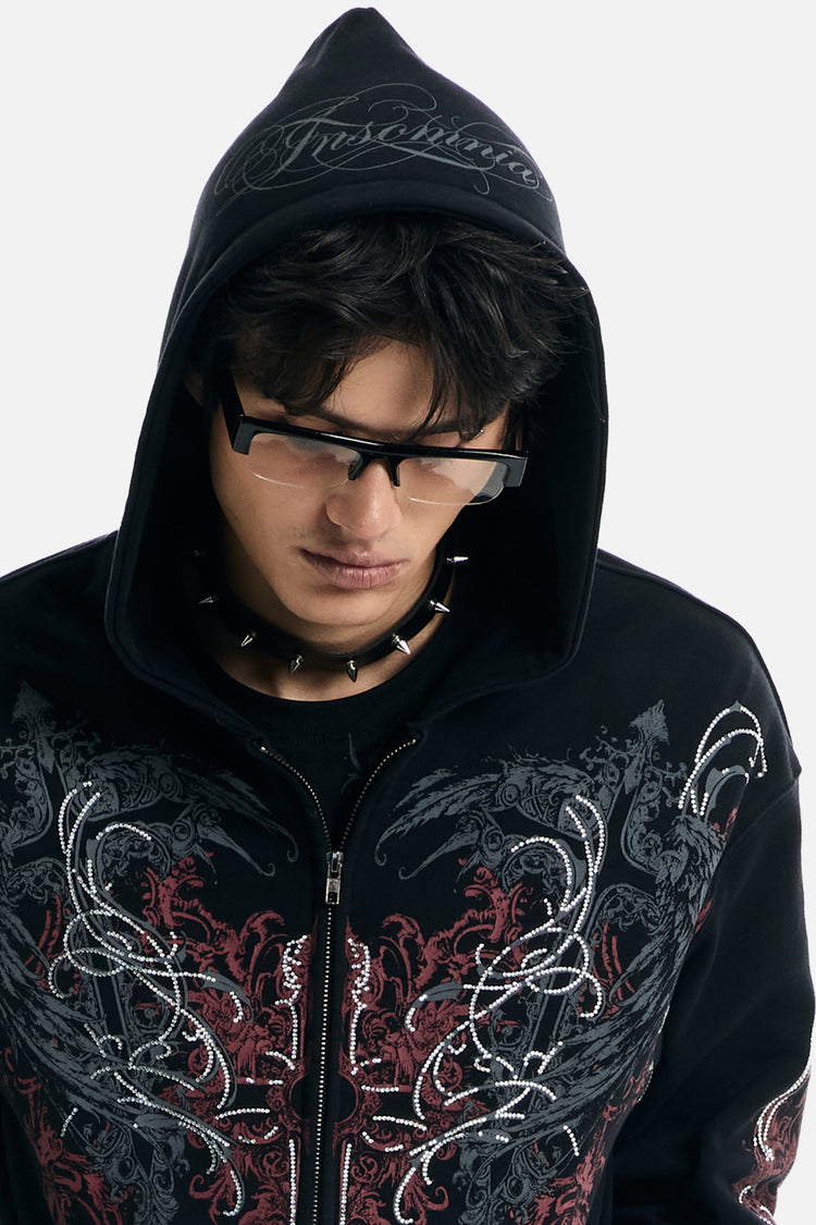Close-up of a model in the Harmony Hoodie with the script-printed hood up