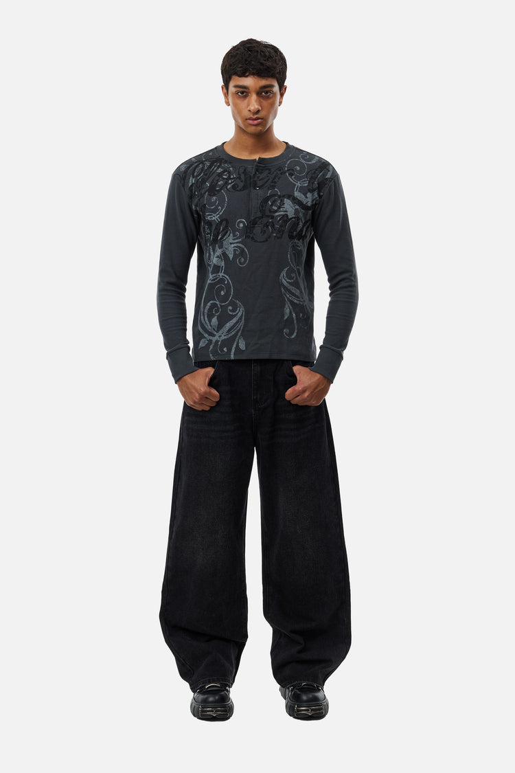 Full-length front view of the Harmony Jeans with a charcoal printed long-sleeve top