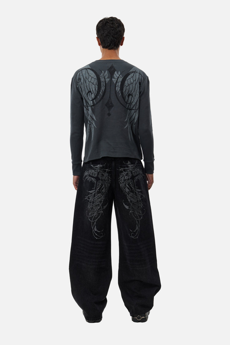 Full-length back view of the black Harmony Jeans showing the embroidered back pockets