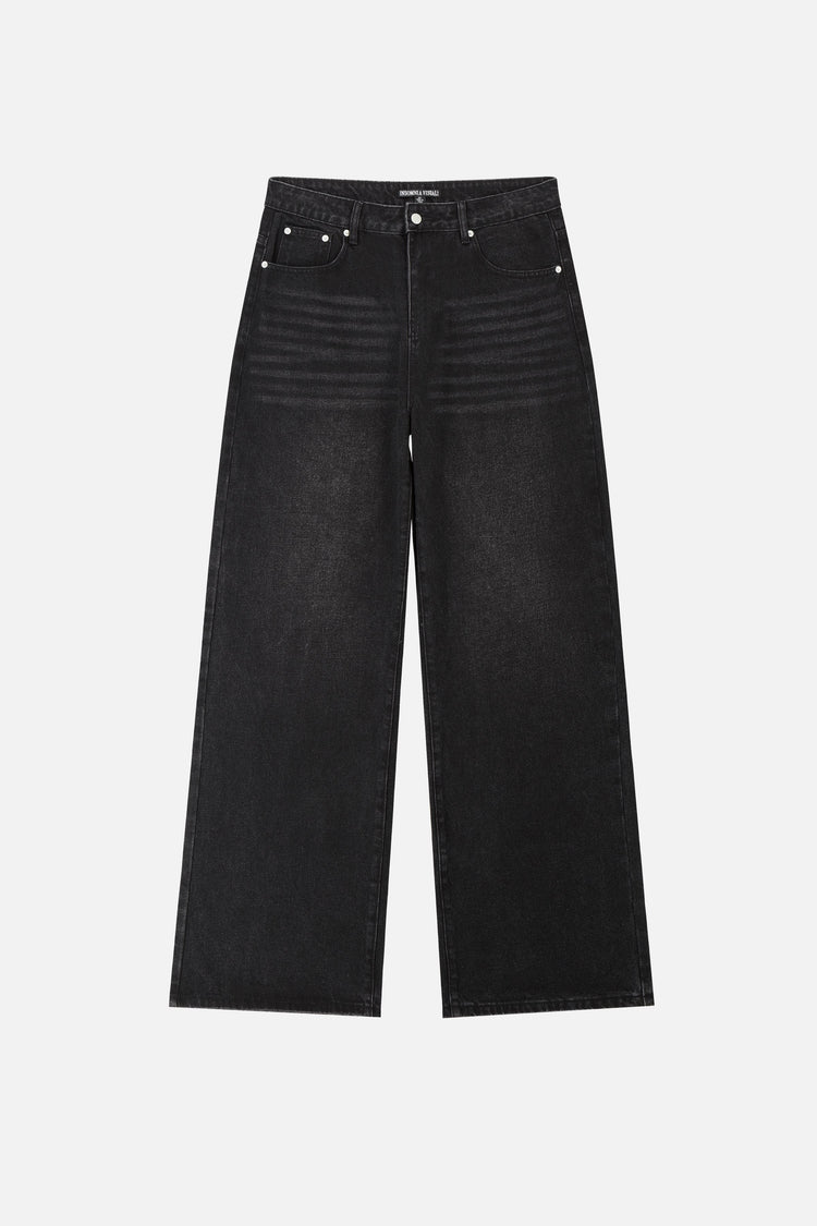 Front of the washed black Harmony Jeans laid flat, wide straight leg