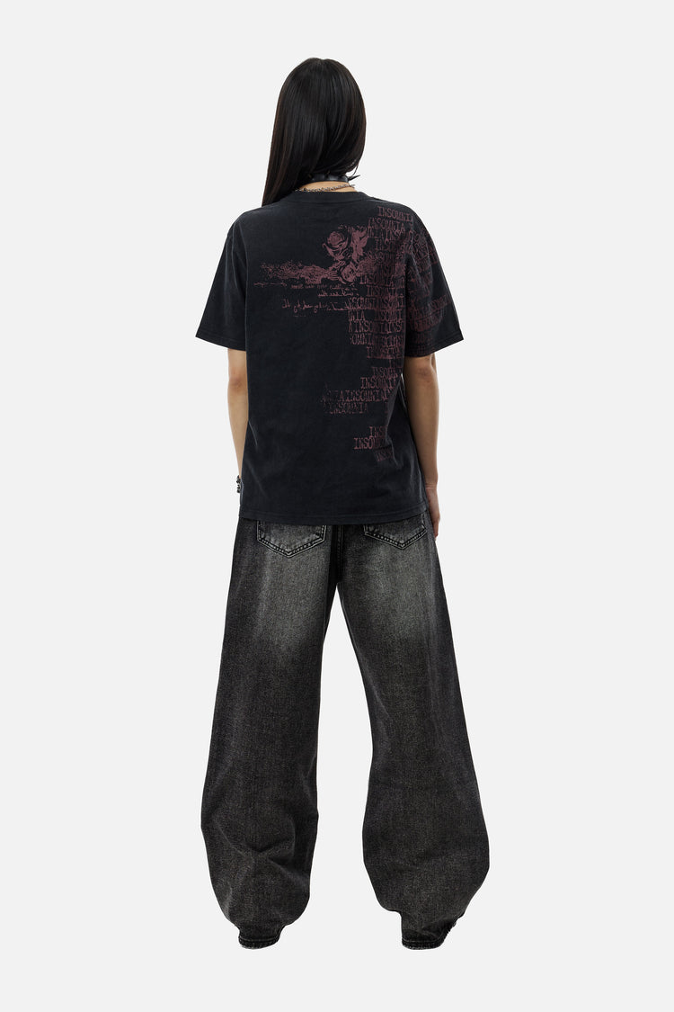 Back view of the Washed Black Outlaw Denim on a model with long black hair and black tee
