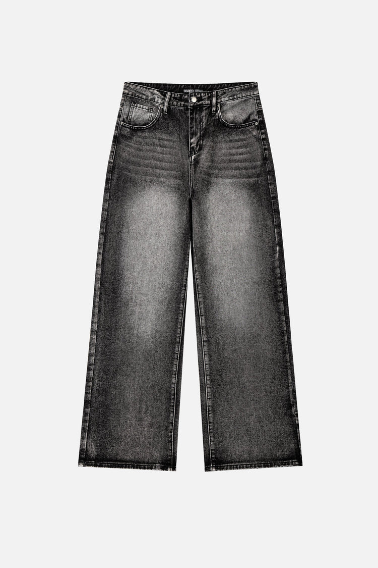Front of the Washed Black Outlaw Denim laid flat, showing the faded gray whiskering