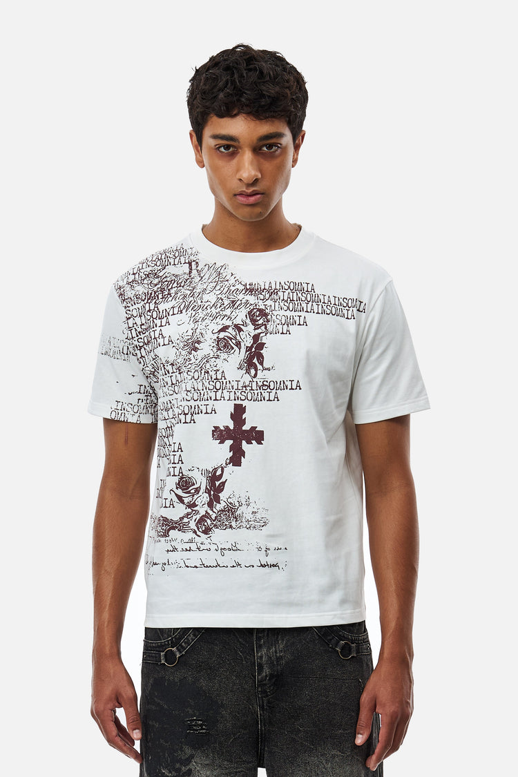 Model wearing the White Messages Tee with burgundy cross and script print, front view