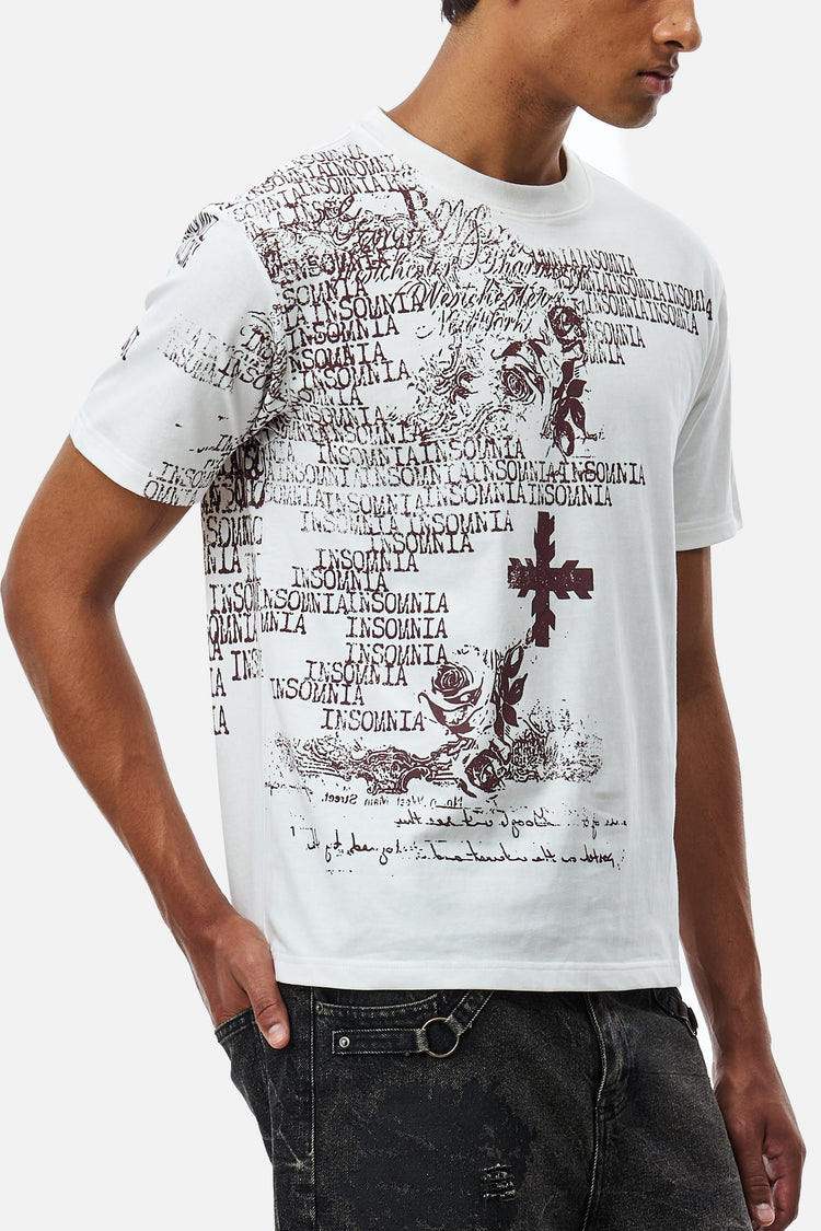 Side view of the White Messages Tee showing the print wrapping onto the sleeve