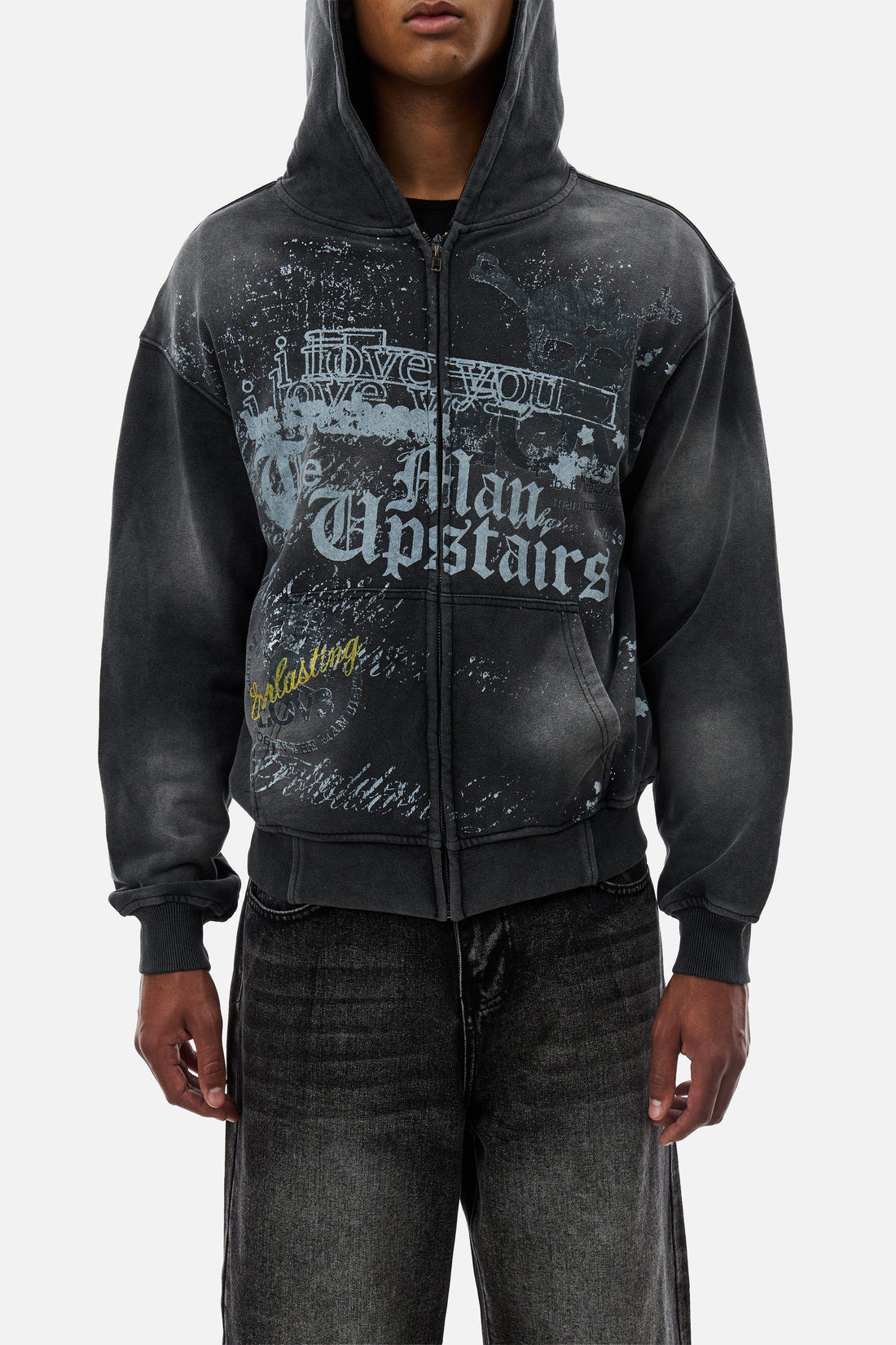 Waist-up front view of the Upstairs Zip Hoodie showing the gothic script and stars print