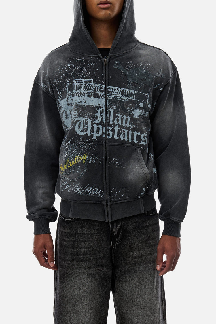 Waist-up front view of the Upstairs Zip Hoodie showing the gothic script and stars print