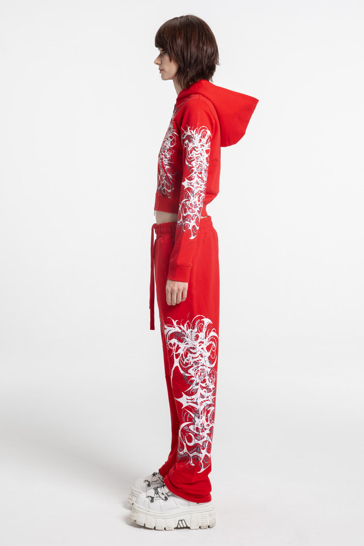 Full-length side view of the Red Eclipse Cropped Hoodie and red sweatpants