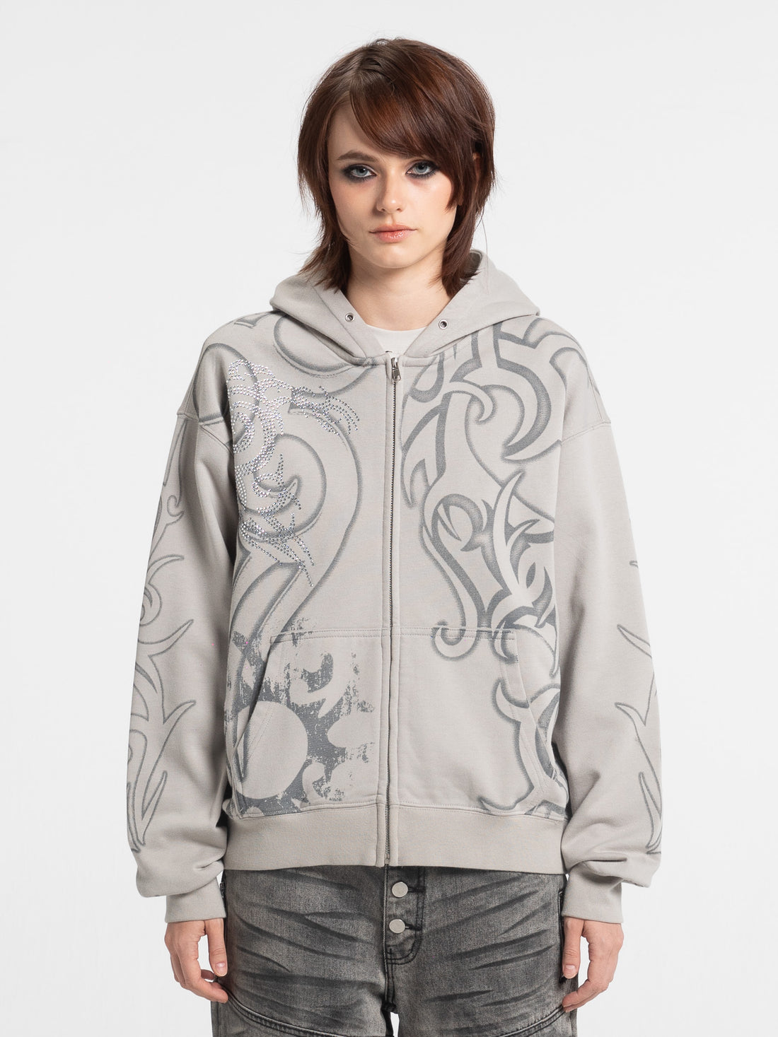 Model wearing the gray Rhinestone Tribal Zip Hoodie with tribal rhinestone print, front view