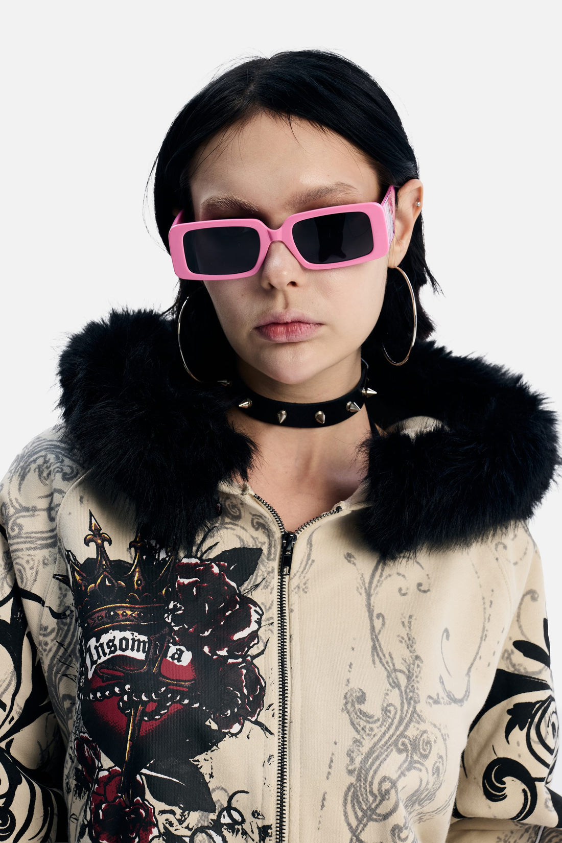 Model wearing the pink Note Glasses with a fur-trimmed hoodie, front view