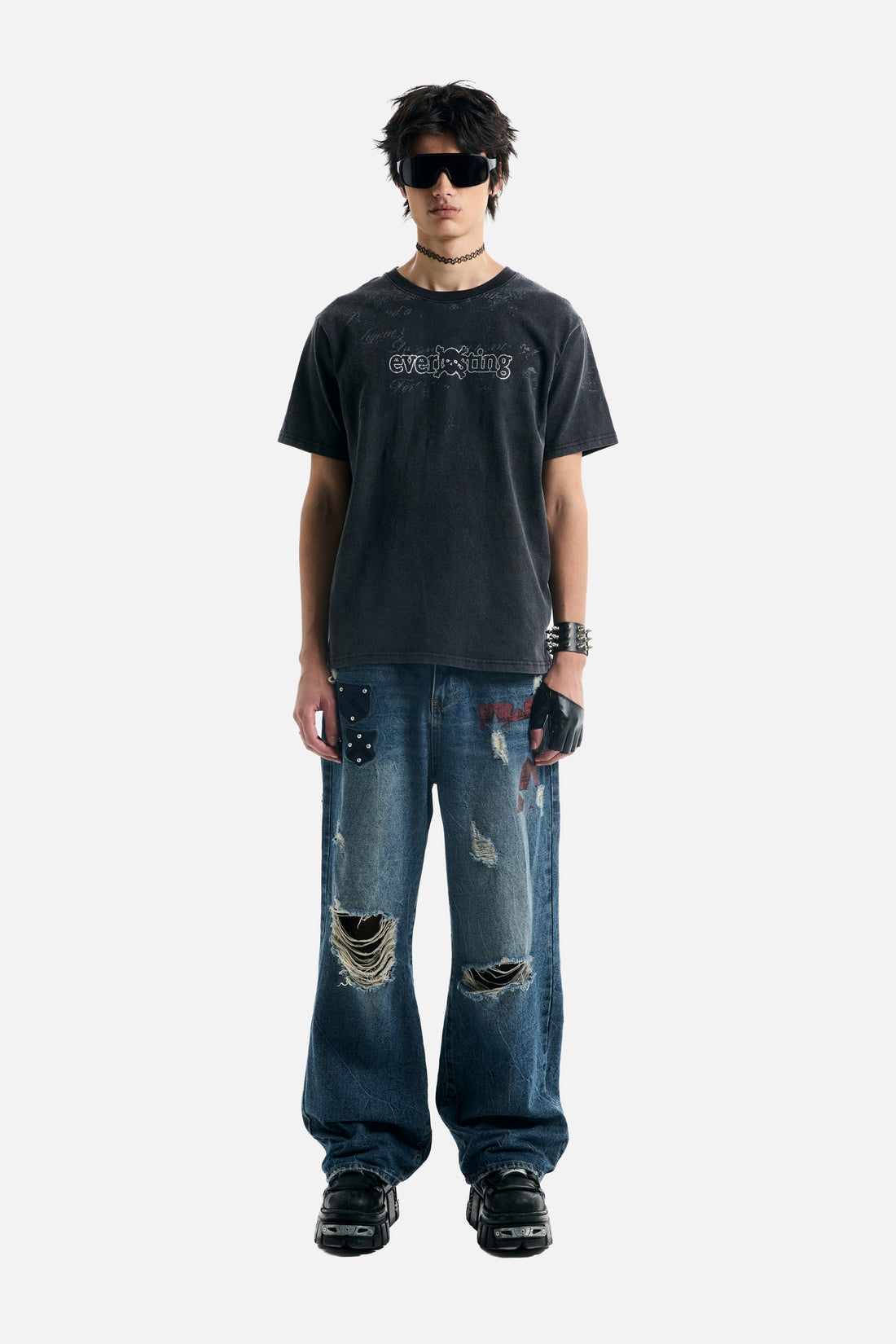 Model in a washed black tee and the Patch Outlaw Denim, full-length front view