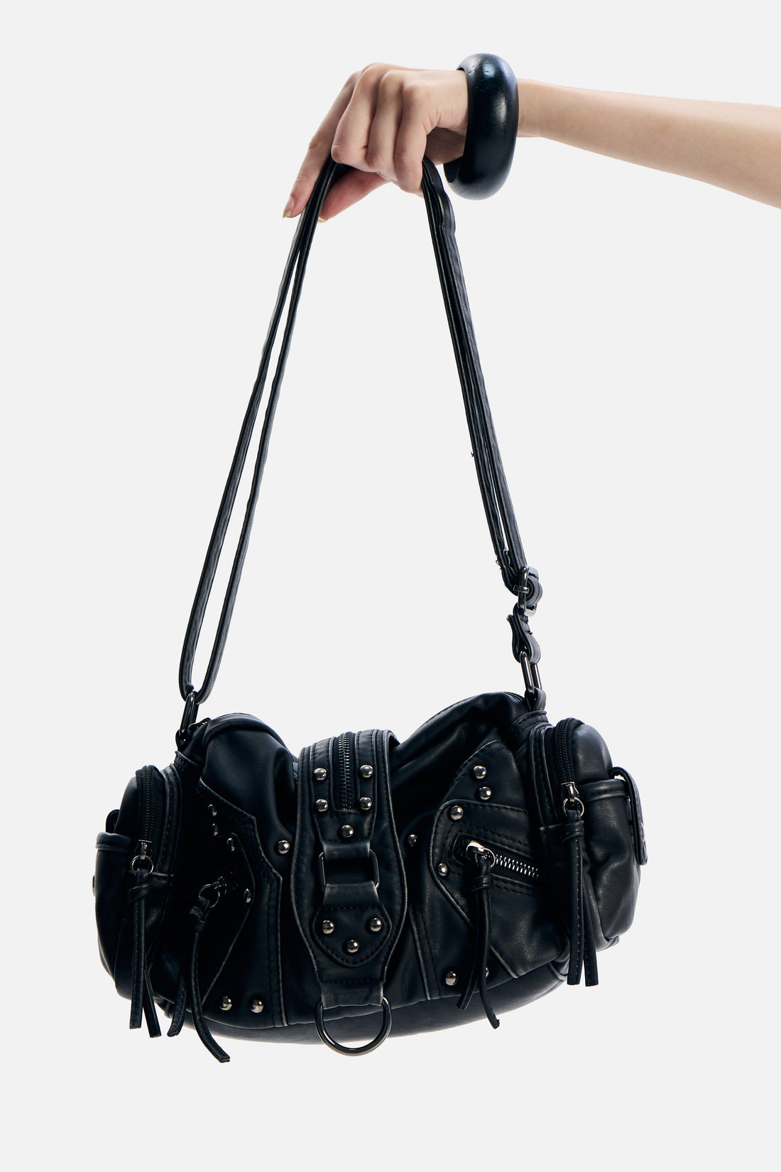 PU Leather Side Rodeo Bag held by its strap, showing studs, side pockets and buckle