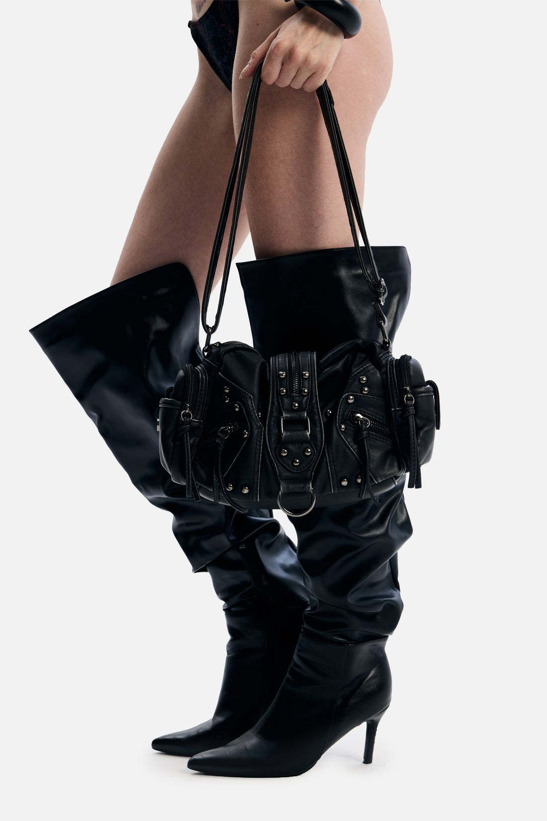 PU Leather Side Rodeo Bag carried by hand with knee-high leather boots