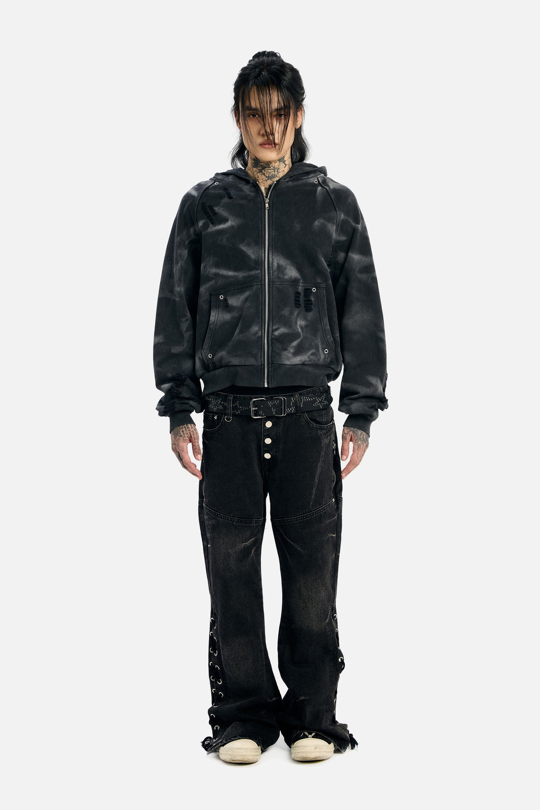 Full-length front view of the Studded Raglan Zip Up Hoodie with flared black jeans