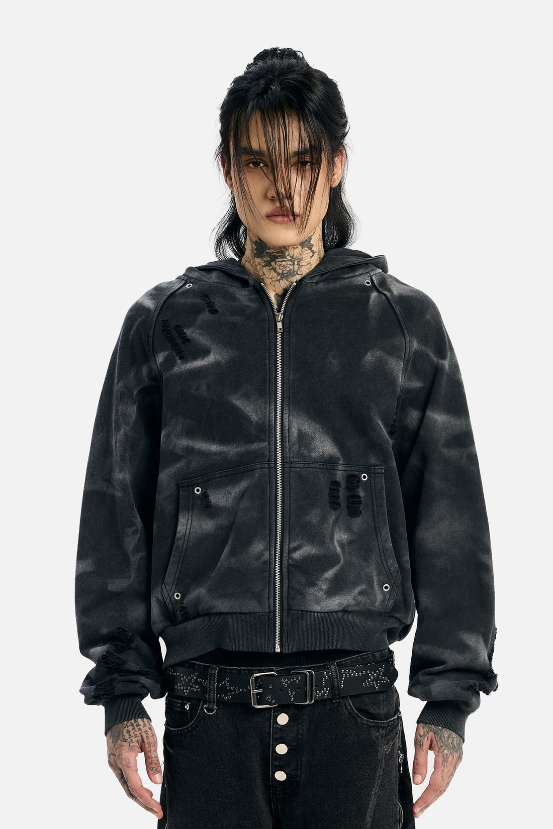 Model wearing the washed black Studded Raglan Zip Up Hoodie unzipped at the collar, front view
