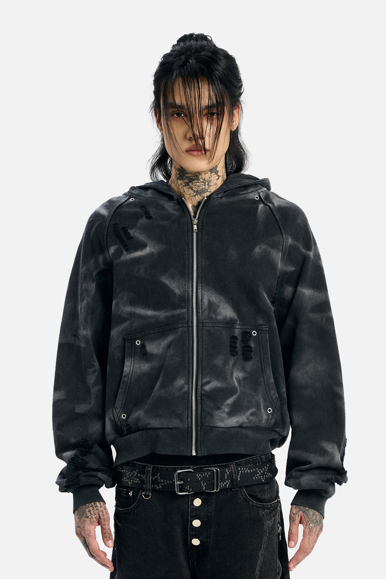 Model wearing the washed black Studded Raglan Zip Up Hoodie unzipped at the collar, front view