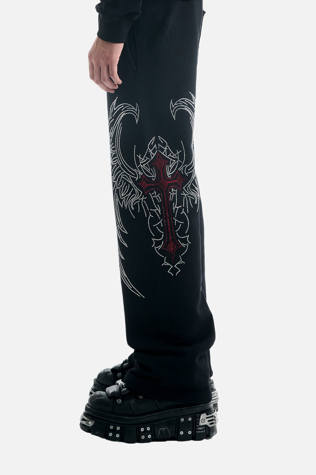 Close side view of the Red Cross Baggy Sweats leg graphic, red cross with silver wings