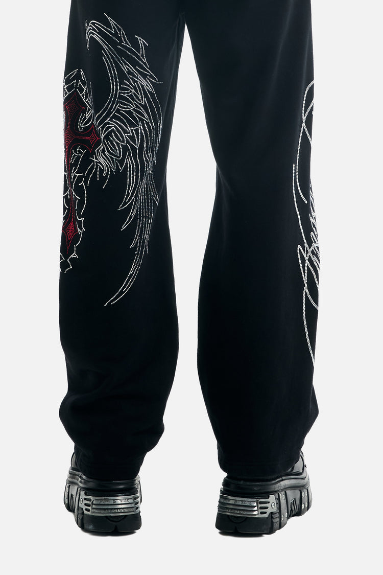 Back view of the Red Cross Baggy Sweats legs showing wing and script graphics