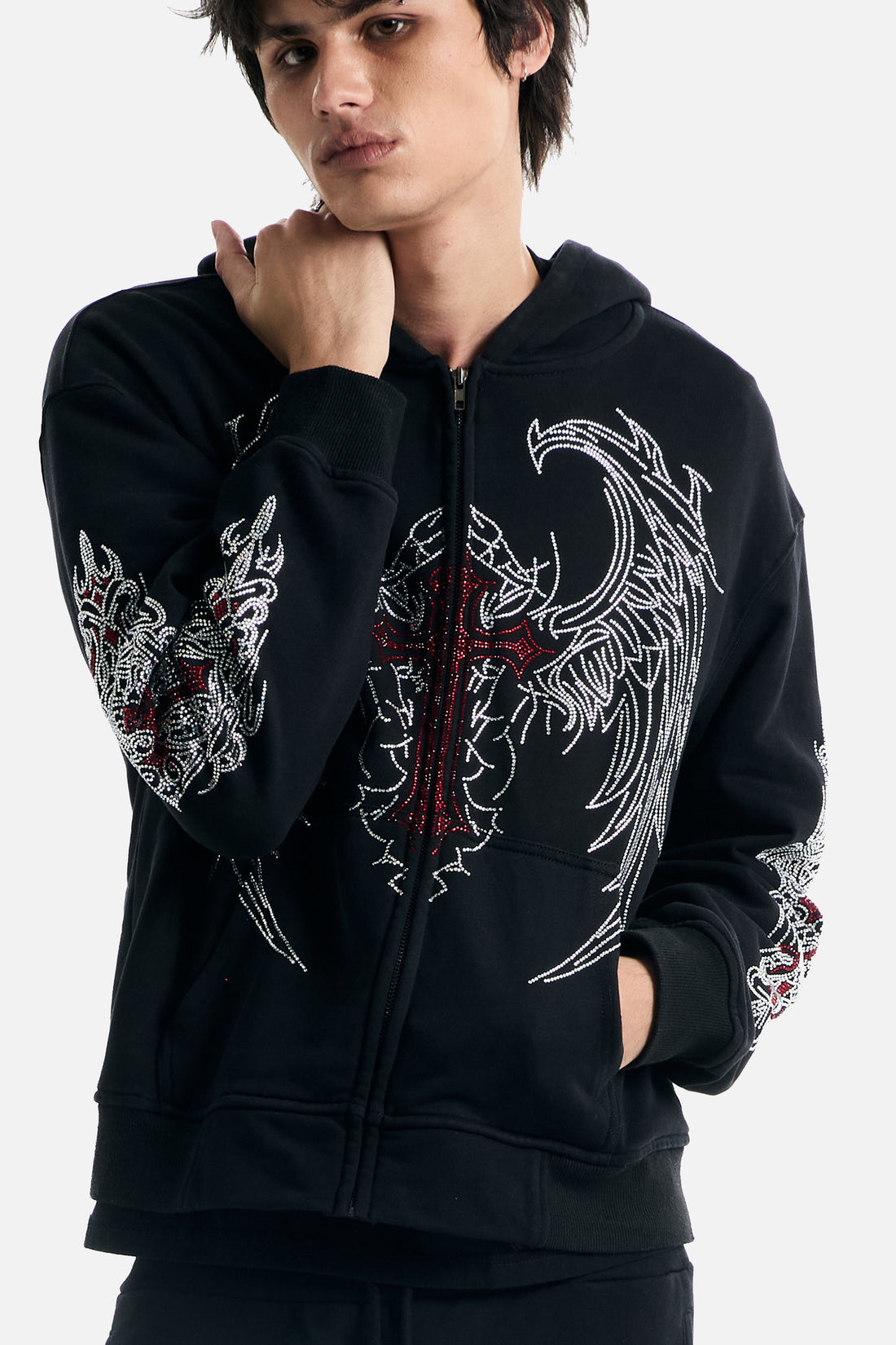 Close-up of the Red Cross Zip Up Hoodie on a model, showing the sparkling wing design