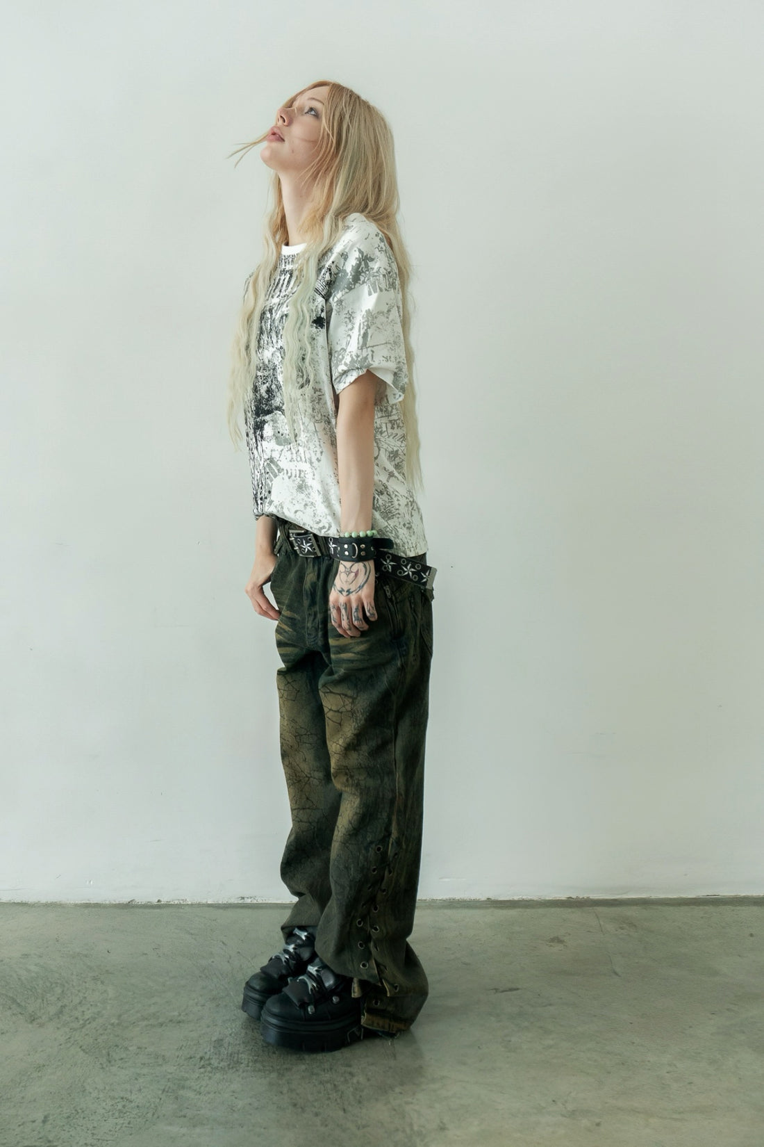 Poem Tee with Shattered Rogue Denim, worn against a white wall