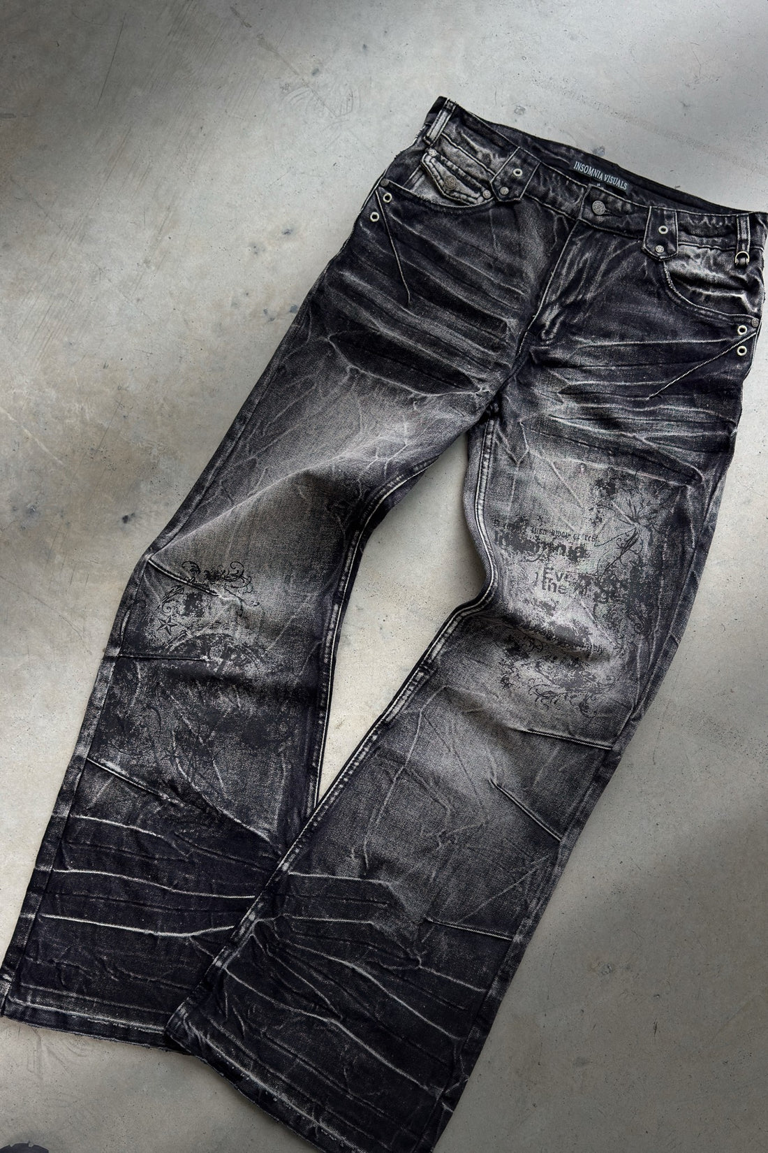 Scripture Rogue Denim V2 laid flat on concrete