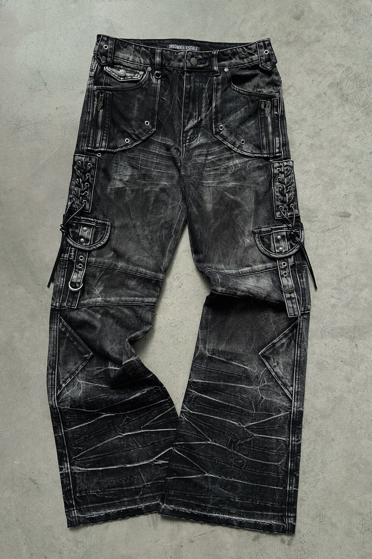 Utility Rogue Denim laid flat on concrete, showing the side lace and pockets
