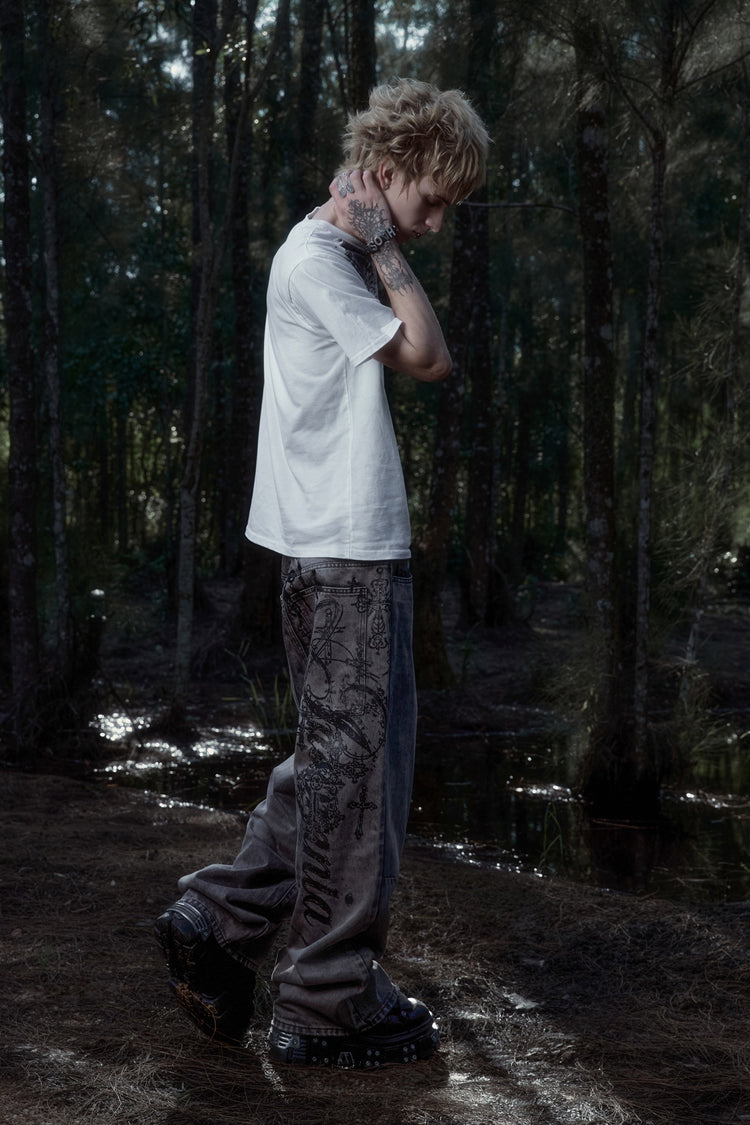 Scripture Tee with Cross Outlaw Denim in a forest, side view