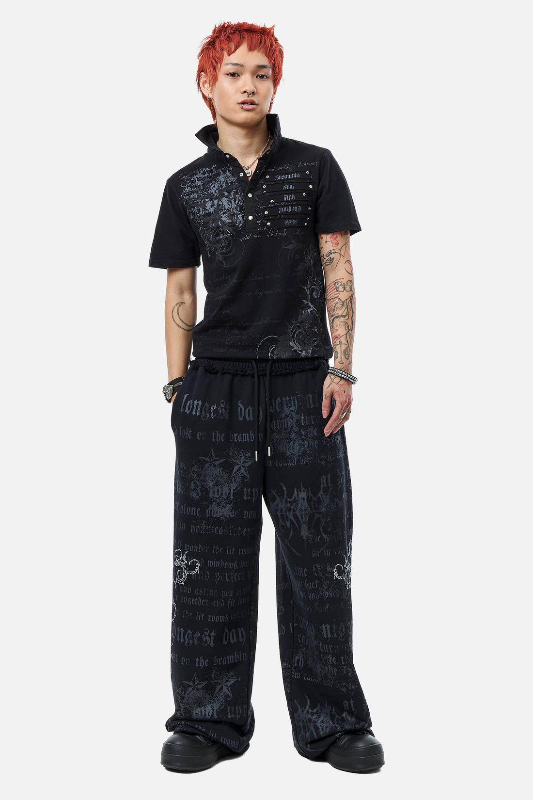 Full-length front view of the Black Thorns Polo with matching printed drawstring pants