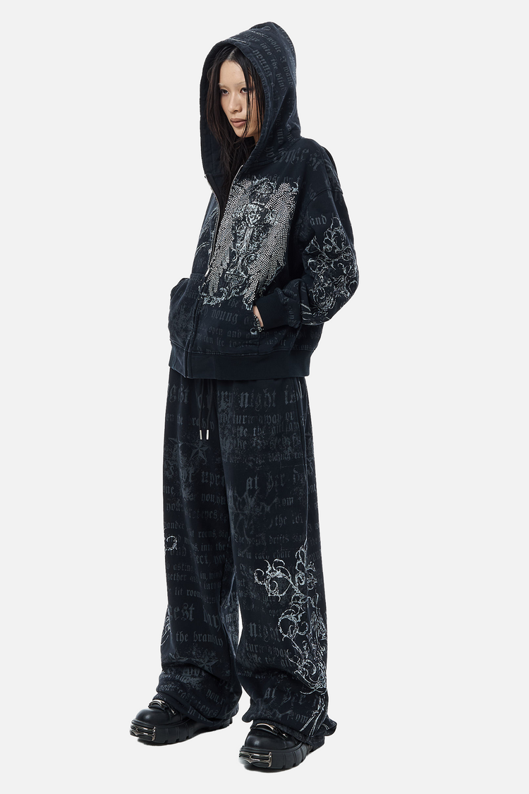 Full-length side view of the Sacred Zip Hoodie and matching sweatpants with chunky sneakers