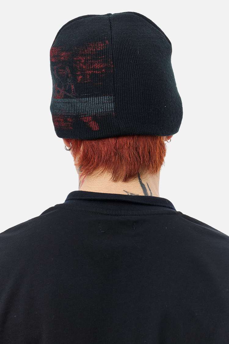 Back view of the Chaos Beanie worn over red hair
