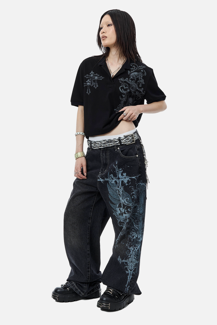 Full-length view of the Skull Garden Polo styled with baggy blue cross print jeans