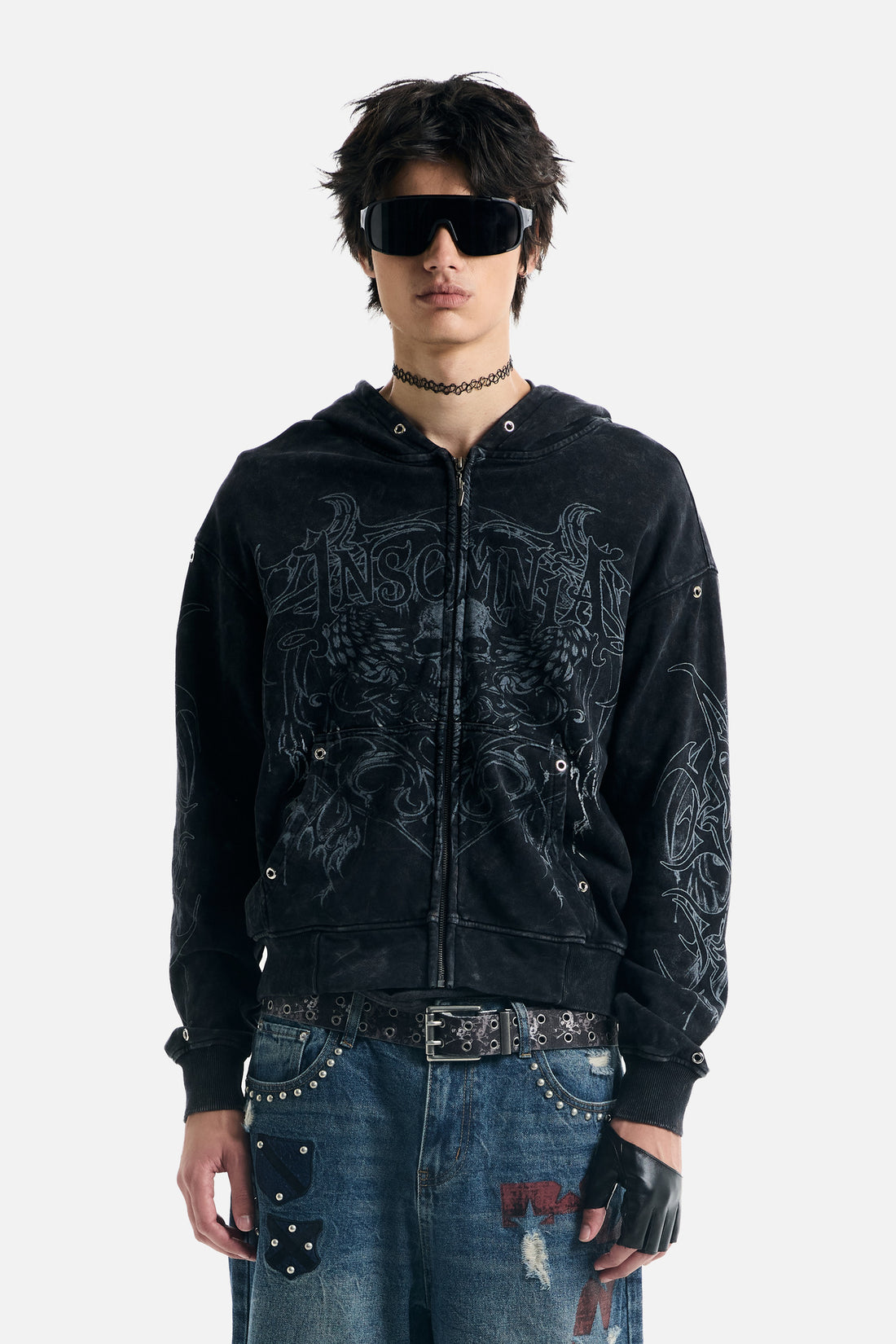 Model wearing the washed black Tribal Zip Up Hoodie with tonal skull and wing print, front view