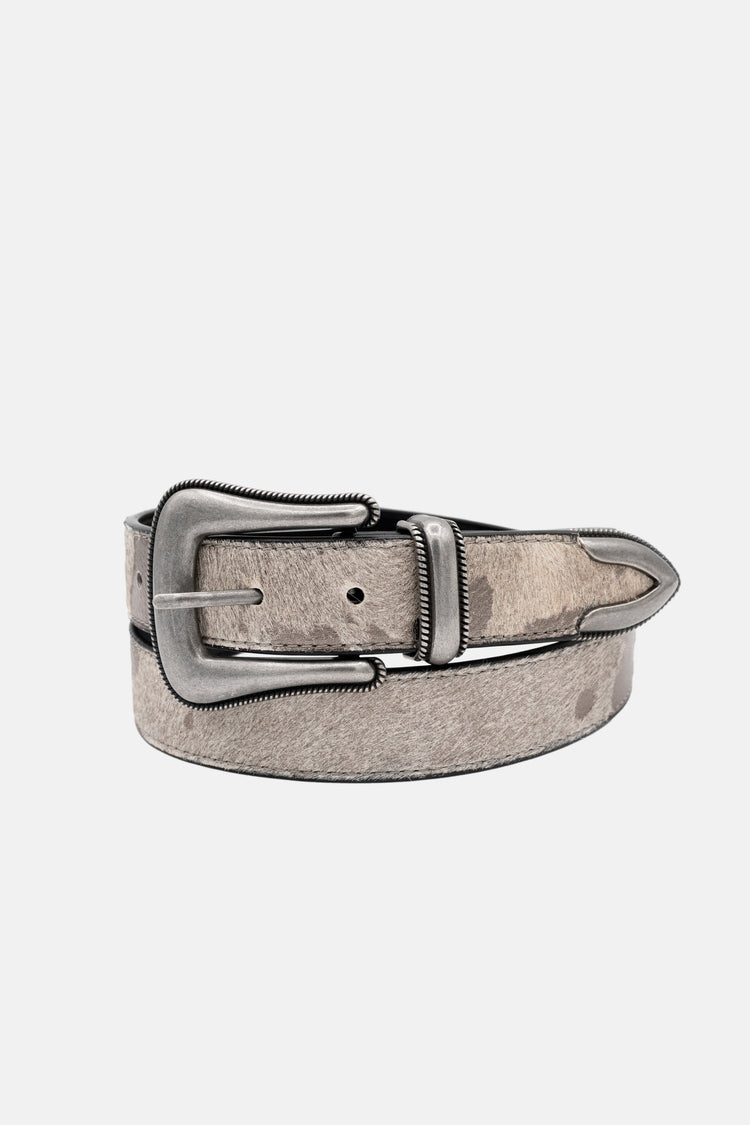 Stallion Belt coiled showing silver western buckle, keeper and pointed metal tip