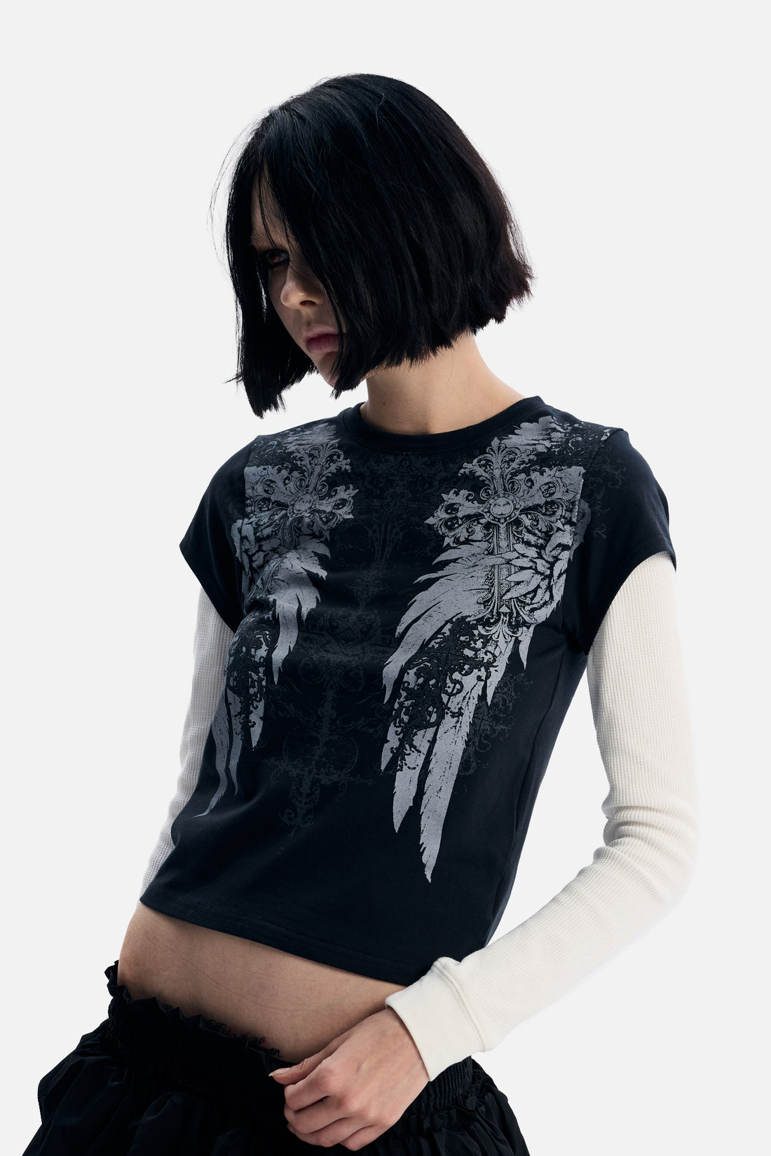 Model looking down in the Wings 2fer Womens Long Sleeve, close front view